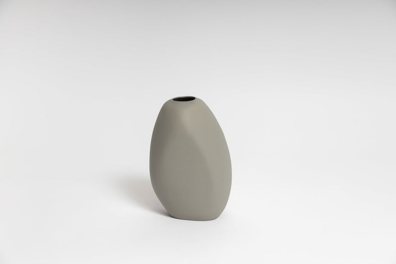 A Harmie Vase - Various Options by Ned Collections, grey LT vase sitting on a white surface.