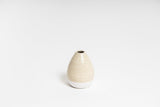 A small beige CHARLIE VASE from the Ned Collections.