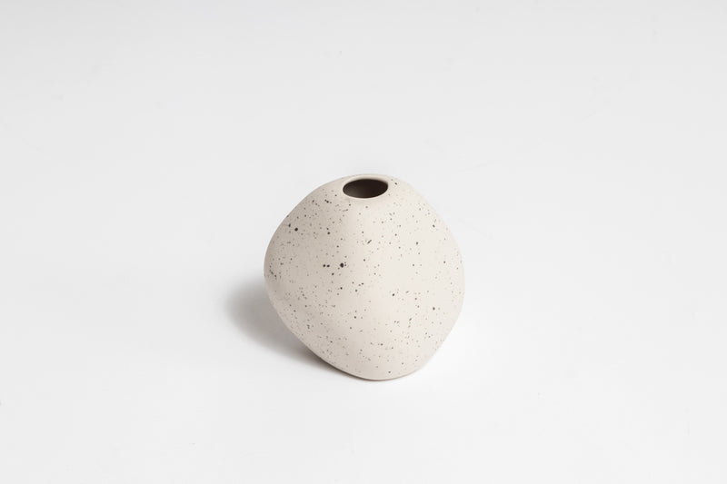 A HARMIE Pebble Vase - Natural, hand-crafted by Vietnamese artisans, sitting on a white surface. (Brand: Ned Collections)
