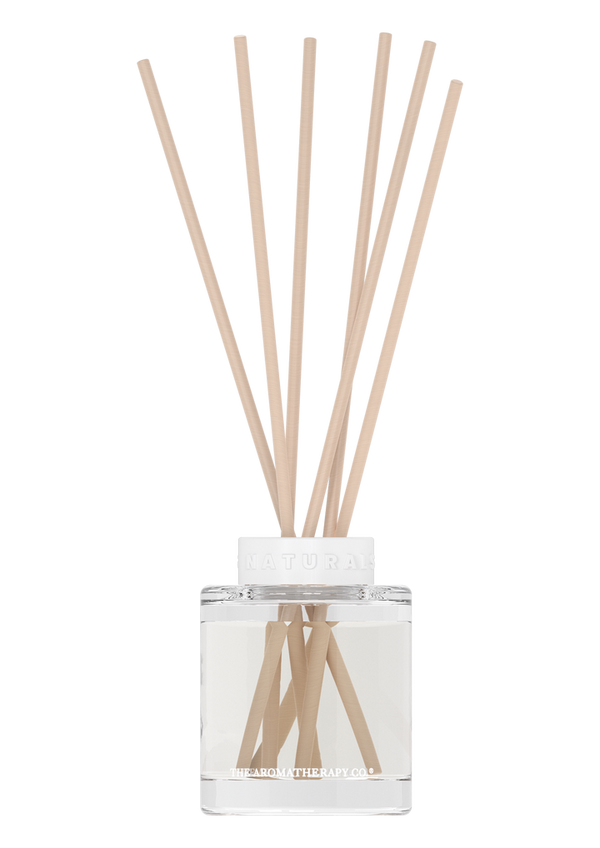 Limited time fragrance: The Aromatherapy Co Naturals Diffuser - Neroli & Amber Wood, in a clear glass container, infused with natural scents and accompanied by wooden sticks.
