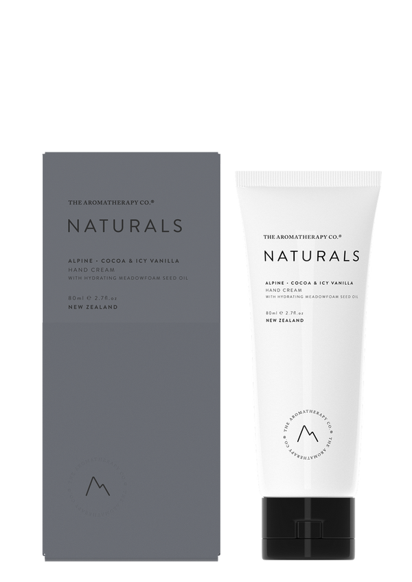 A tube of Naturals Hand Cream Alpine - Cocoa & Icy Vanilla from The Aromatherapy Co with antioxidant and protective properties next to a box.