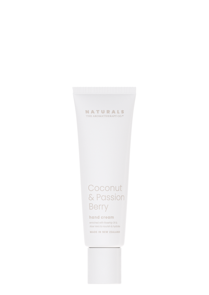 A tube of Naturals Hand Cream - Coconut & Passion Berry by The Aromatherapy Co on a black background.
