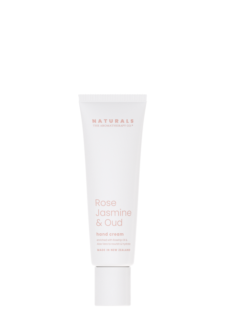 A tube of Naturals Hand Cream - Rose Jasmine & Oud, by The Aromatherapy Co, boasting natural ingredients, set against an elegant black background.