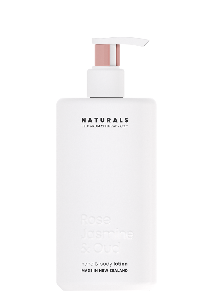 Naturals Rose Jasmine & Oud hand and body lotion in a white bottle with a blush pump collar, on white