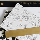 A black and white To do floral notebook with a ruler, featuring lined notebooks bound with a durable wire-o binding by Papier HQ.