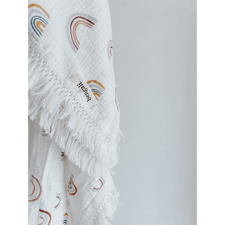 A white Muslin Fringe Swaddle - Rainbow towel made of Oeko-tex® Certified Cotton from Bengali Collections.