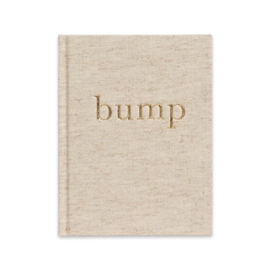 A beige nursery diary book with the word "Bump - A Pregnancy Story" by Write To Me on it.