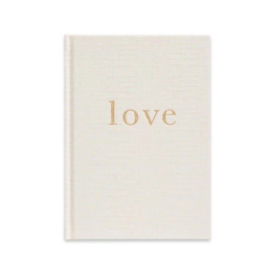 A gender neutral book with the product name "Love - Our Wedding Planner" by the brand "Write To Me" on it that serves as a guided wedding planner.