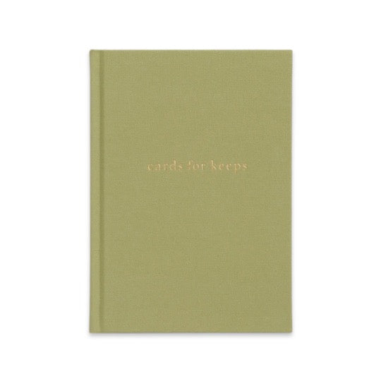 A green CARDS FOR KEEPS notebook with a gold lettering from the brand Write To Me.
