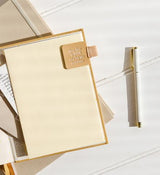 A refillable notebook with a Metal Rollerball Pen in Butter Gingham from Emma Kate Co.