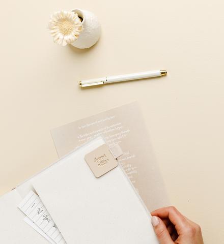 Metal Rollerball Pen Cashmere styled on desk with notebook by Emma Kate Co