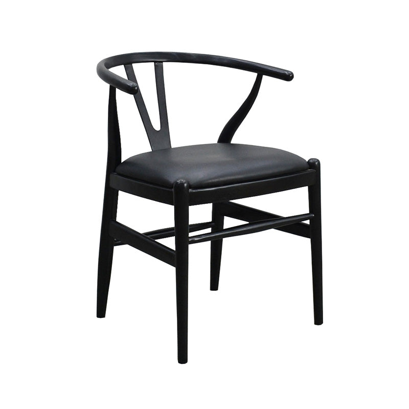 Wishbone chair in black stained timber with a black leather seat, at a three quarter angle