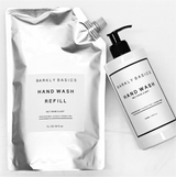 A bottle of Barkly Basics eco-friendly hand wash and a refill in Nectarine & Mint scent.