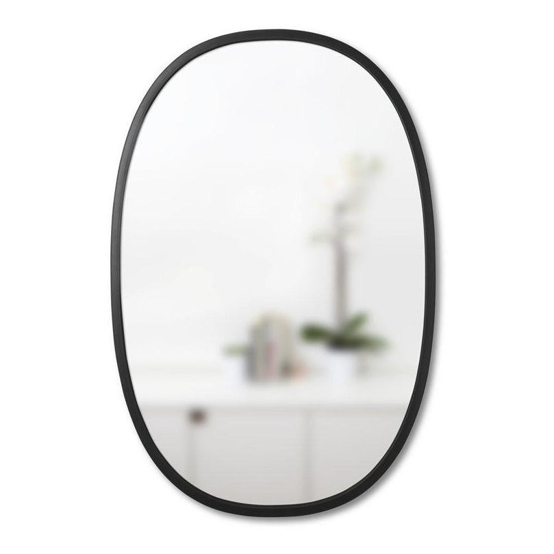 Umbra Hub oval black mirror with rubber frame on wall