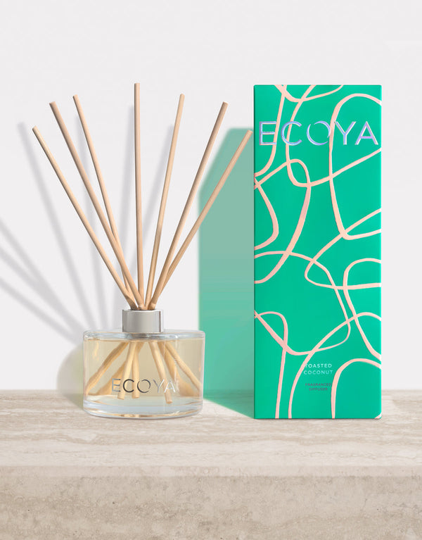Ecoya's Limited Edition | Toasted Coconut Fragranced Diffuser, a scandinavian home fragrance, on a table next to a box.