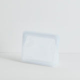A STAND UP MINI-CLEAR bag on a white surface.