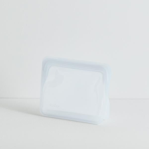 A STAND UP MINI-CLEAR bag on a white surface.