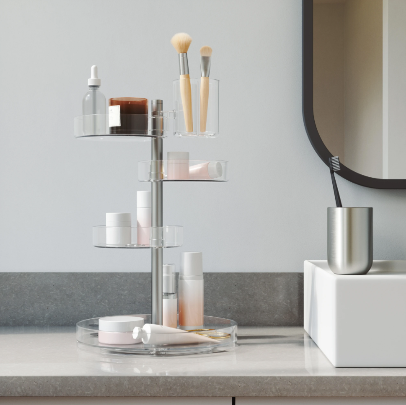 Umbra Pirouette organiser on a bathroom vanity holding brushes and skincare