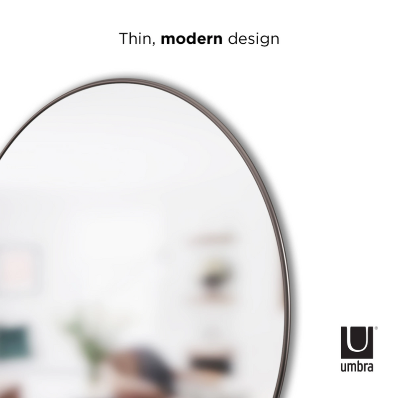 An Umbra HUBBA MIRROR 34 TITANIUM with a thin modern design and decorative metal frame.