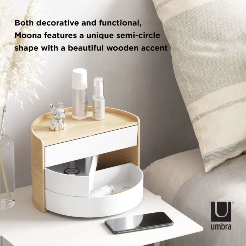 Umbra Moona storage box in white and natural on a bedside table with skincare bottles