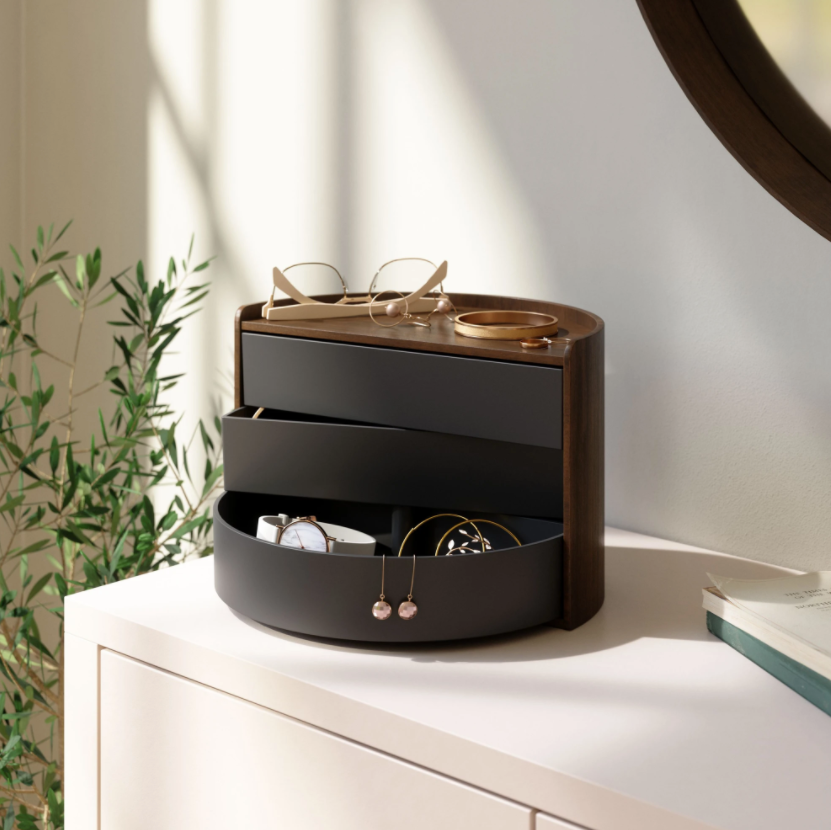 Umbra Moona storage box in black and walnut on a dresser, holding jewellery and glasses