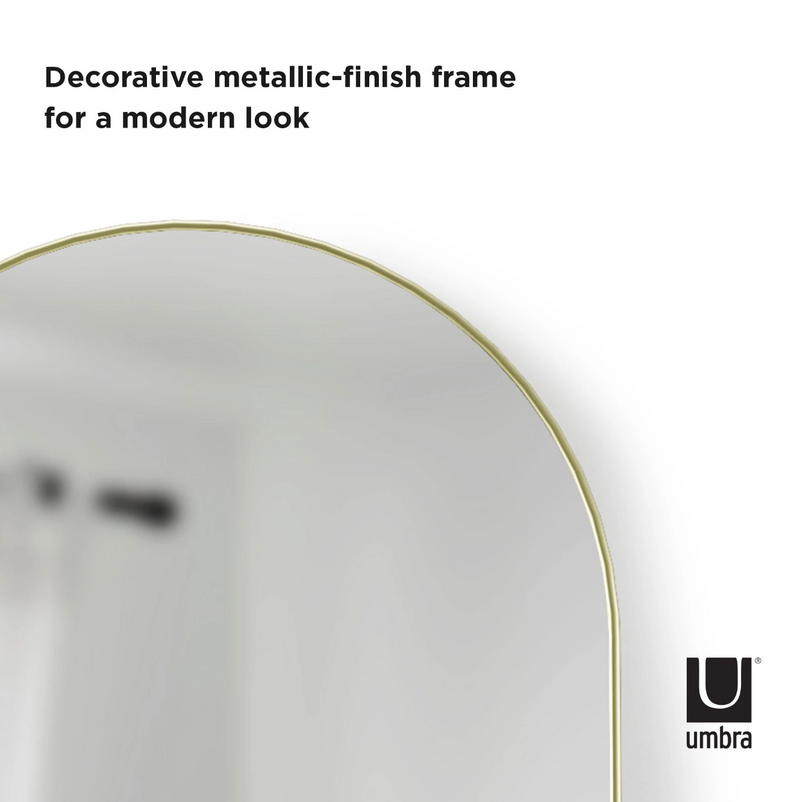 Umbra's HUBBA ARCHED LEANING MIRROR - BRASS, with a decorative metal finish, brings a modern aesthetic to your space.