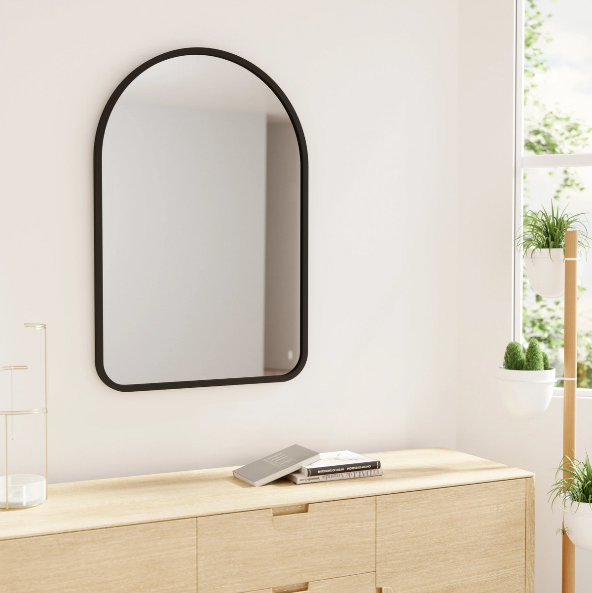 Umbra Hub arched mirror 61x91cm black styled in an entryway