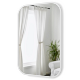 A white Umbra HUB Rectangle Mirror in a room with curtains and a plant.