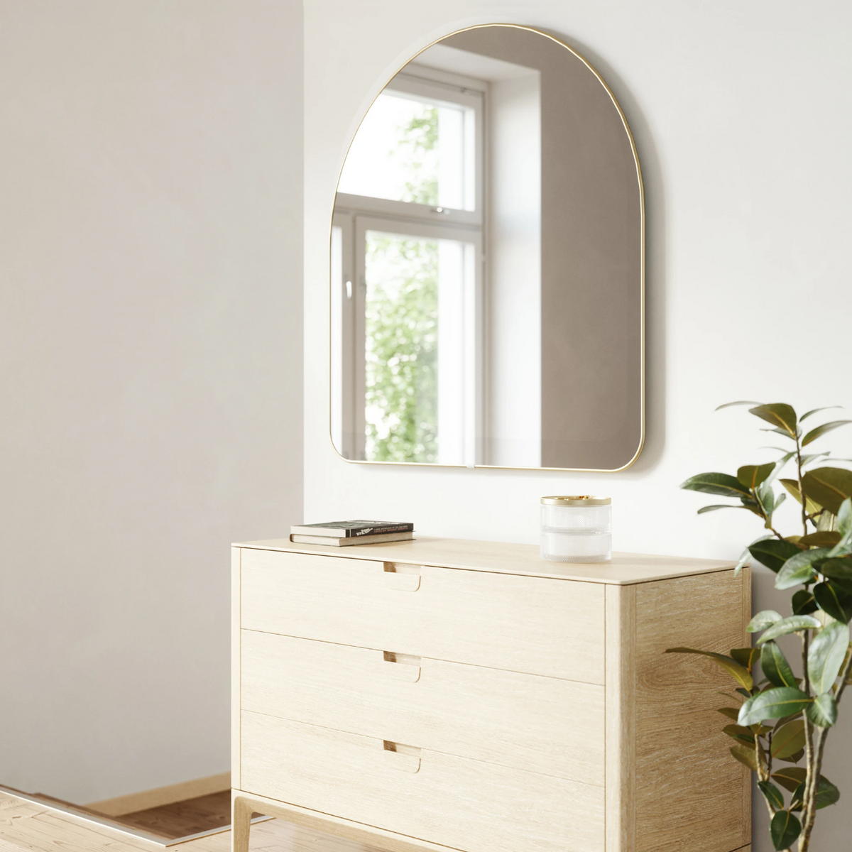 Umbra Hubba Arched Mirror in brass 86x91cm styled in a bathroom