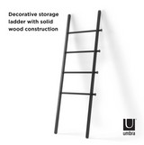 The Umbra LEANA LADDER - BLACK is a decorative storage solution with a solid wood construction.
