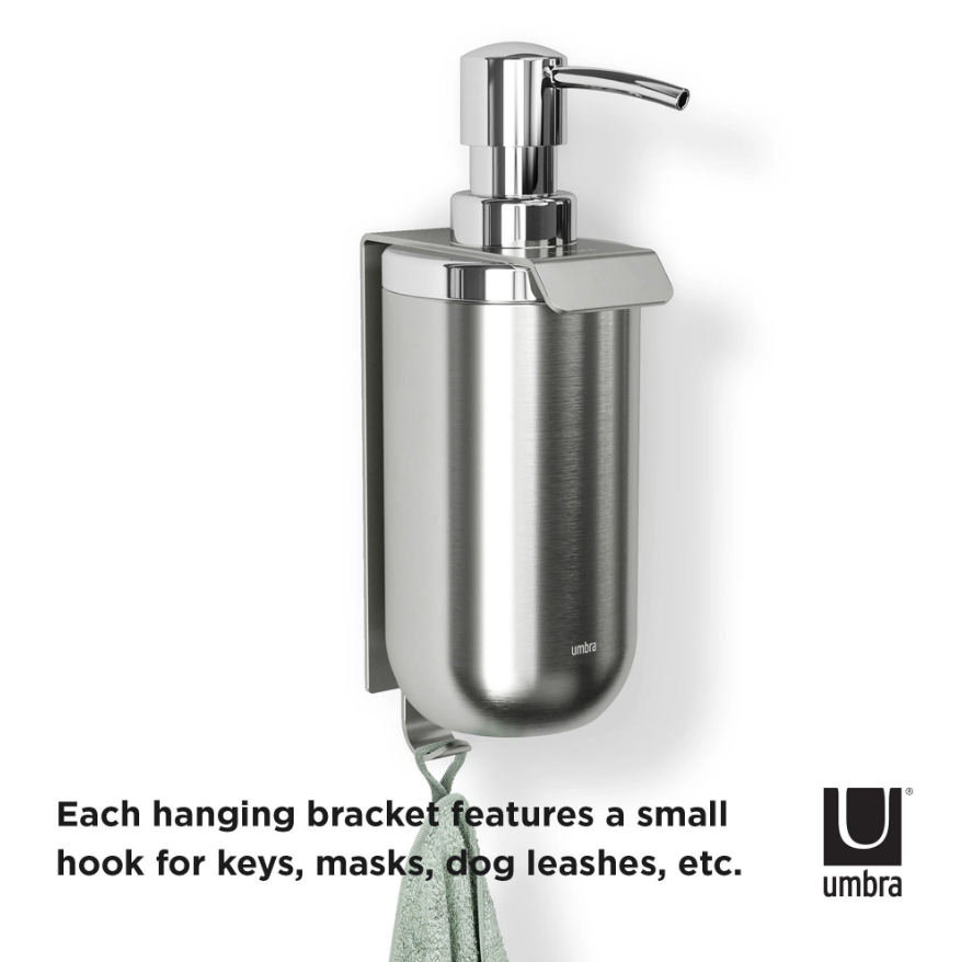 Umbra Junip single wall soap pump on its bracket with a towel hook beneath