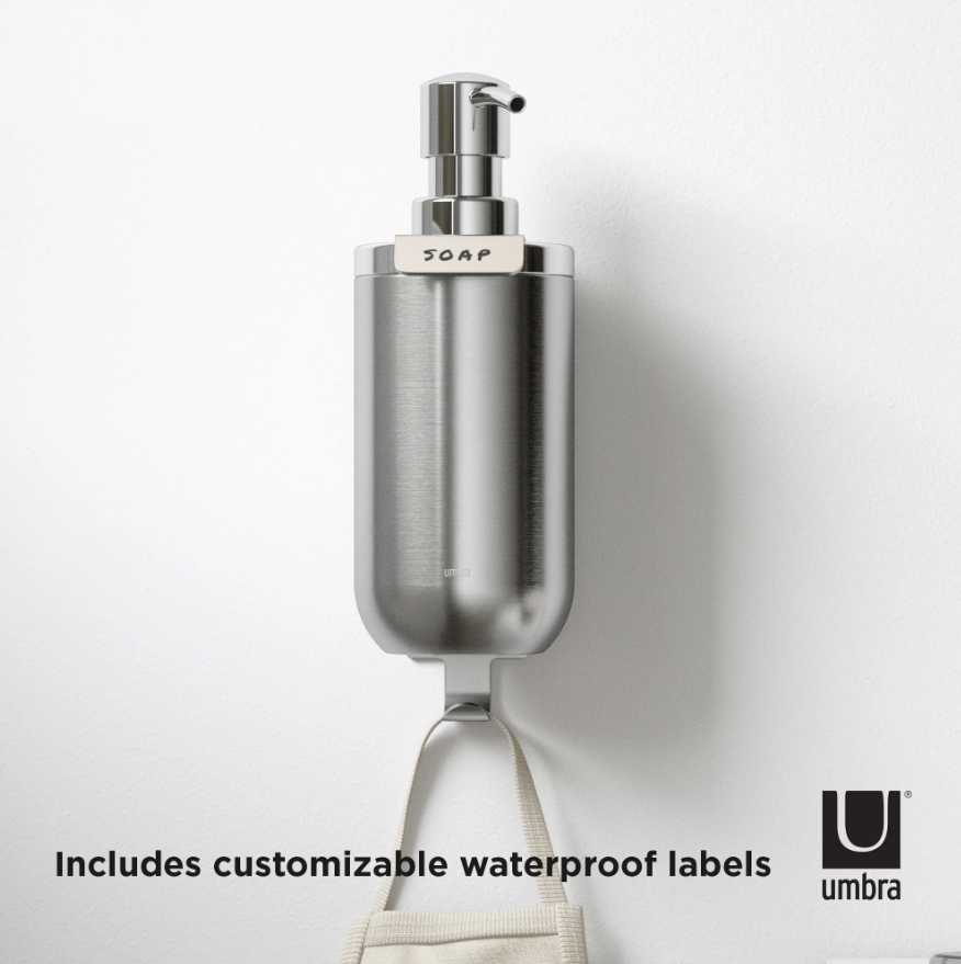 Umbra Junip wall soap pump with a customisable waterproof label reading soap