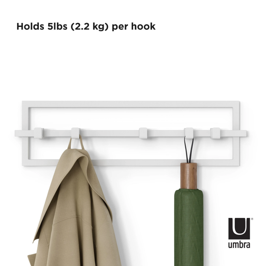 Umbra Cubiko 5 hook wall rack in white with a tan jacket and a green umbrella hanging