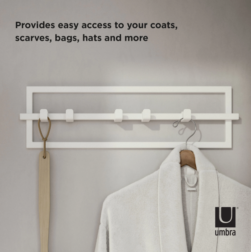 Umbra Cubiko 5 hook wall rack in white holding a coat on a hanger and a woven strap
