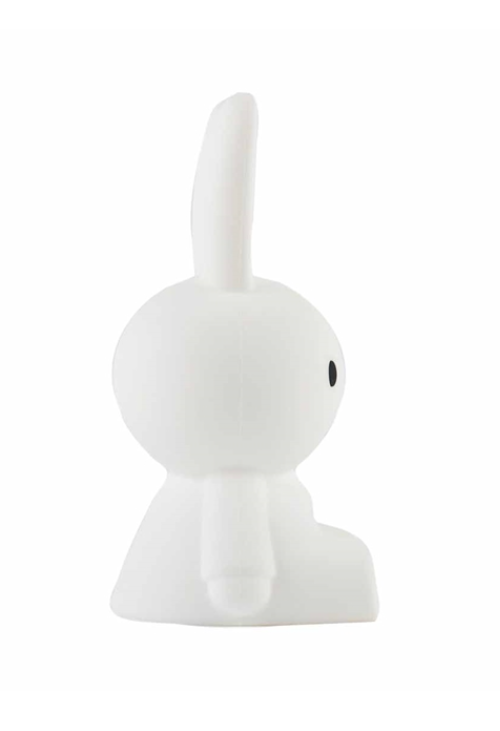 A Miffy Bundle of Light figurine sitting on a white surface.