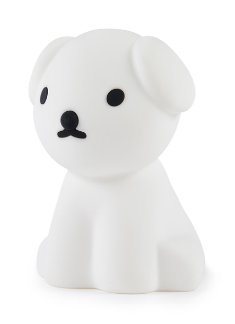 The Snuffy First Light Lamp by Mr Maria, a white dog shaped night light, illuminates a white surface using an LED module.