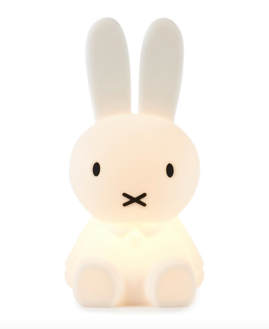 A small Miffy First Light Lamp by Mr Maria sitting on a white surface.