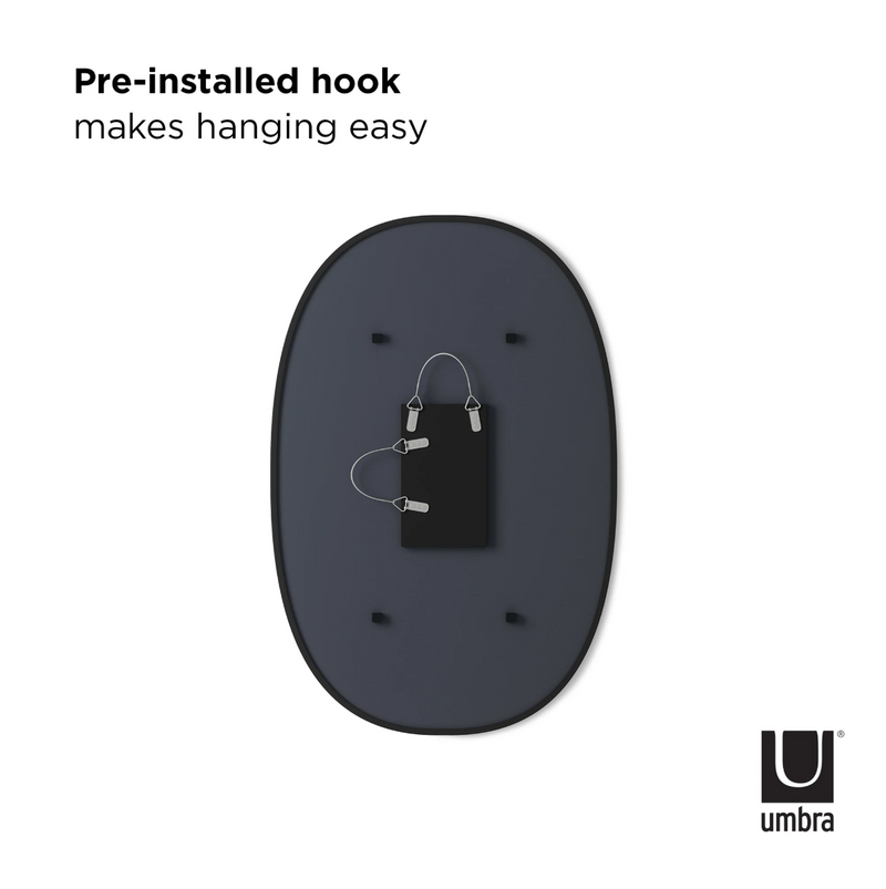 The Umbra Hub Mirror Oval - Black includes a convenient rubber rim, making hanging easy.