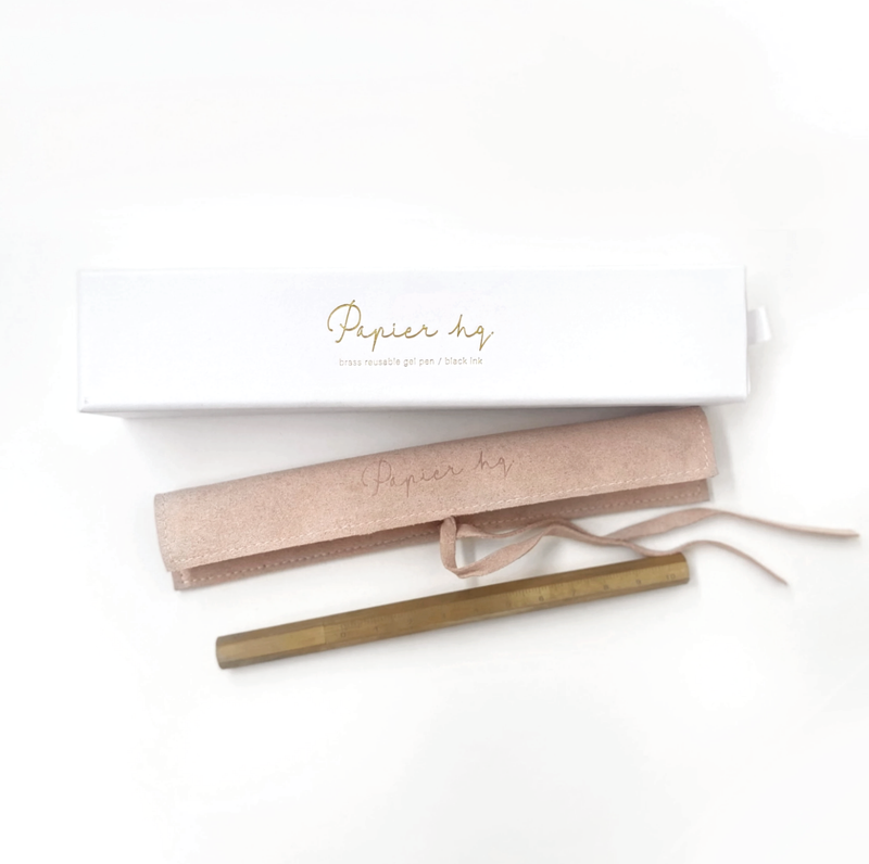 A limited edition box filled with a Brass Reusable Pen from the Papier HQ stationery range.
