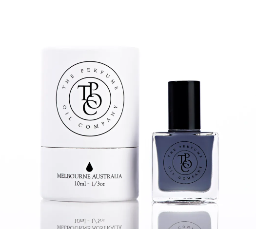 A bottle of JETT, inspired by Black Orchid (Tom Ford) nail polish with a box next to it in the collection from The Perfume Oil Company.
