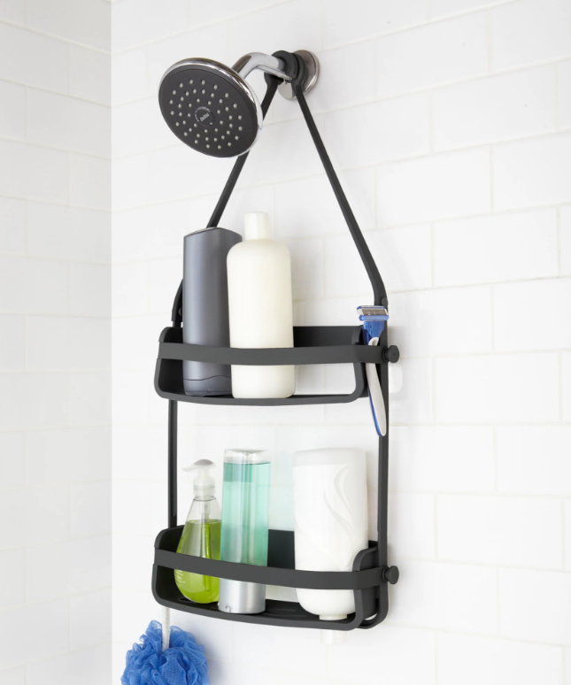 Umbra Flex shower caddy in black on a shower head, two shelves with bottles