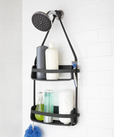 The FLEX SHOWER CADDY - Black / White by Umbra is a versatile shower shelf that seamlessly combines a shower head and soap dispenser, making it the perfect solution for organizing your shower essentials.