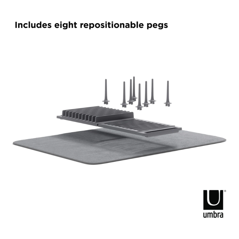 A black and white image of an Umbra UDRY PEG DRYING RACK WITH MAT.