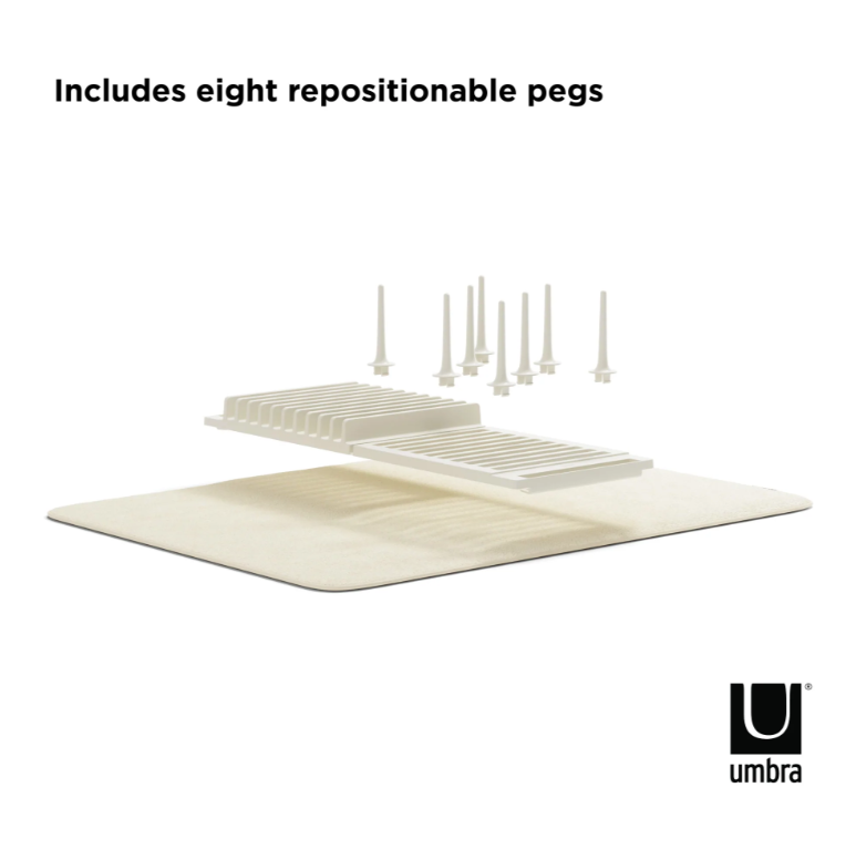 A picture of a toilet with an UDRY Peg Drying Rack with Mat for toilet paper drying. (Brand name: Umbra)