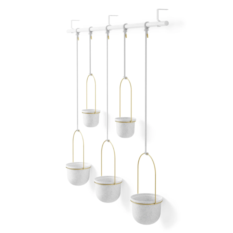 Umbra Triflora five pot hanging planter shown empty on its wall rail