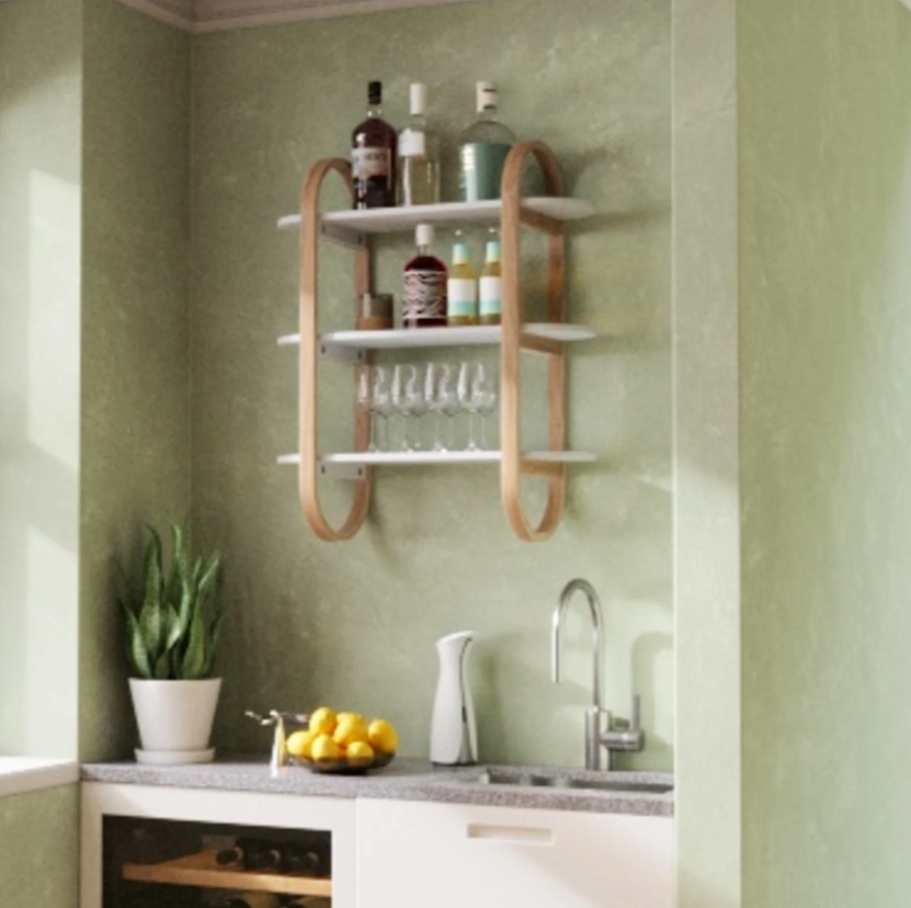 Umbra Bellwood three tier wall shelf in natural on a green kitchen wall holding jars