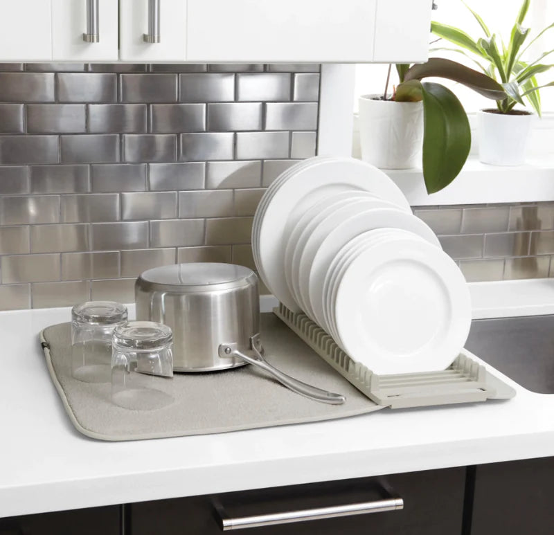 A Udry Drying Mat Mini with dishes and pots on it.