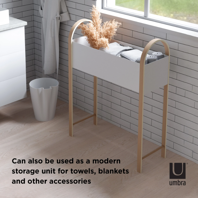 A modern BELLWOOD STORAGE / PLANTER unit for towels, blankets and other versatile accessories by Umbra.
