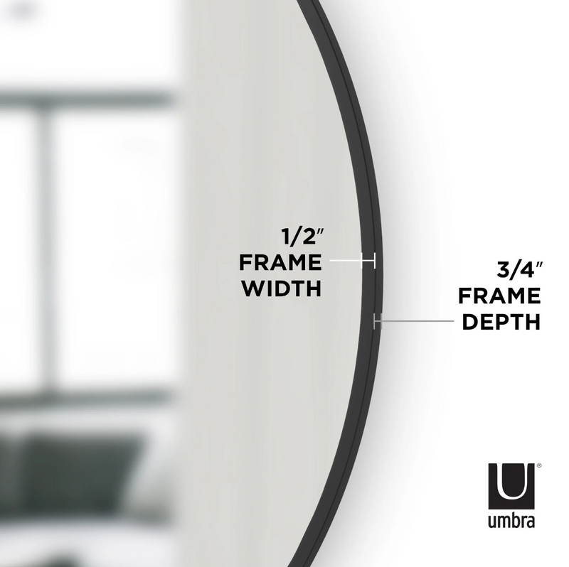 A Umbra HUB Mirror - Large, elegantly placed in a living room.