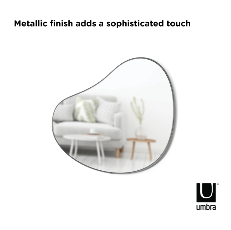 The Umbra HUBBA PEBBLE MIRROR's metallic finish adds a sophisticated touch.